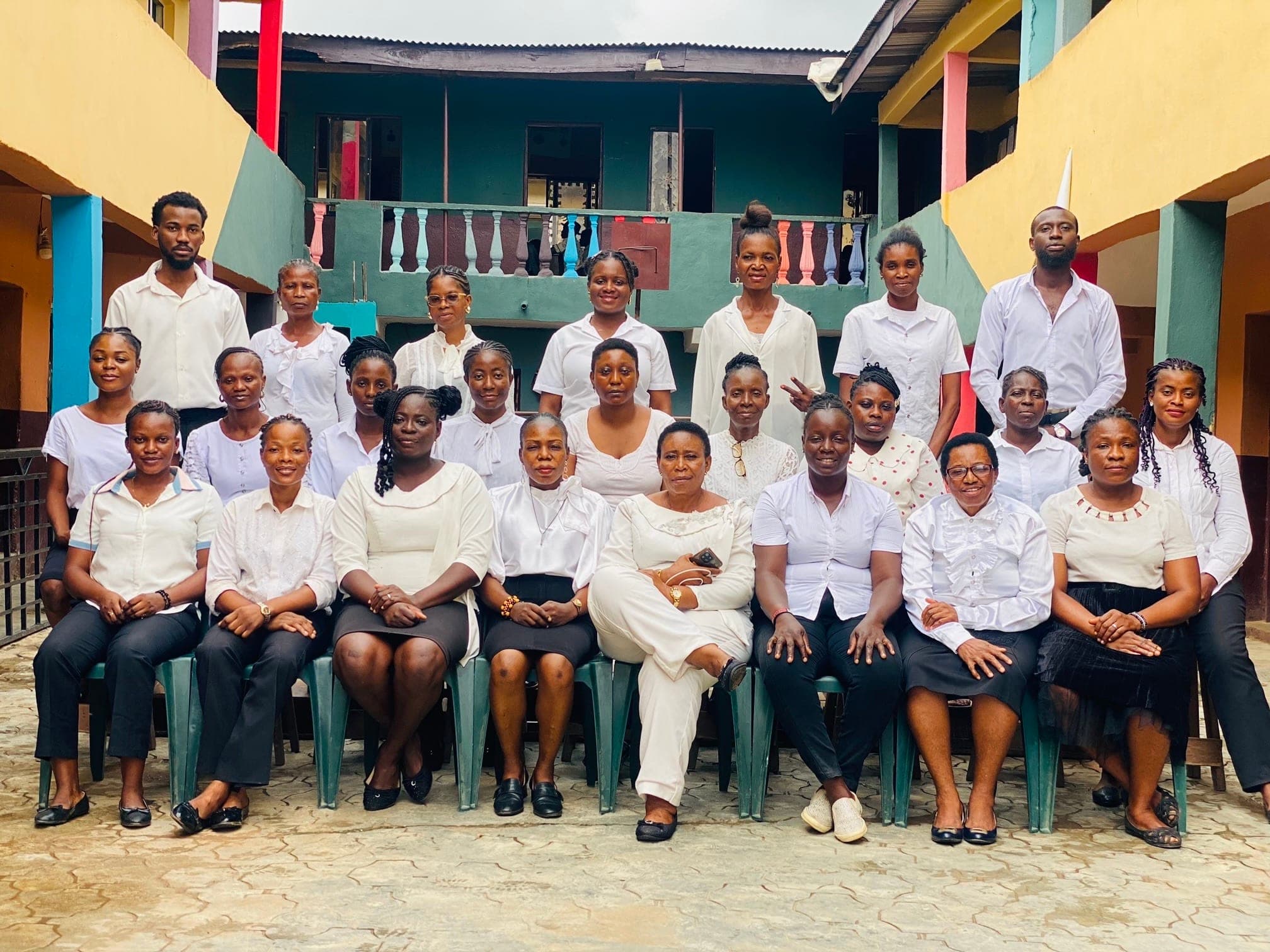 Teaching and non-teaching staff of Nike-Cherished School gathered in the school courtyard